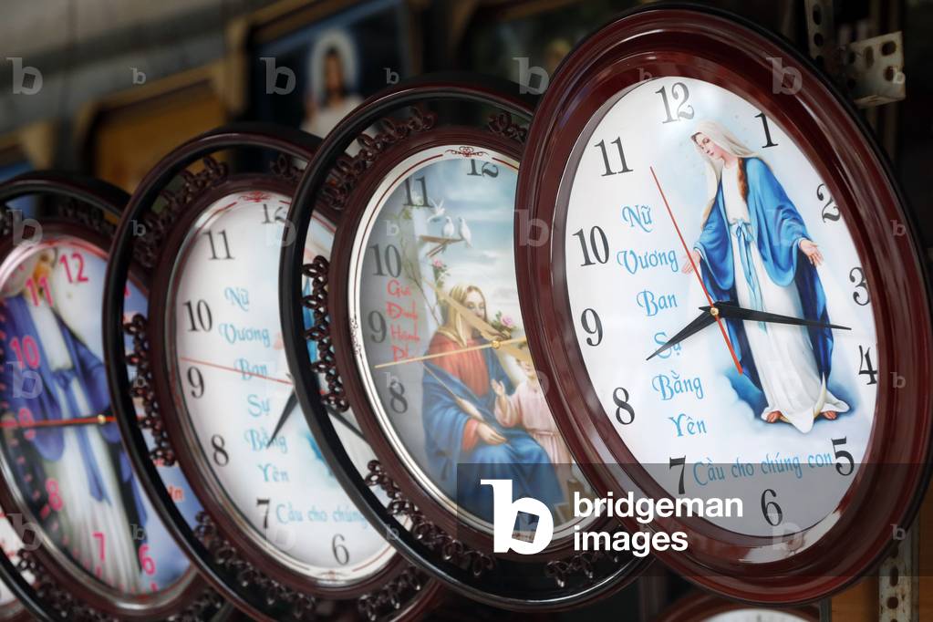Shop selling religious christian items,  Holy Virgin cloks, Ho Chi Minh City, Vietnam (photo)
