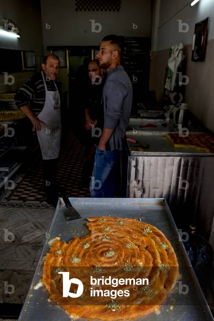 Palestinian knaffieh (cheese pastry) shop in Nablus, West Bank, Palestine, 2018 (photo)
