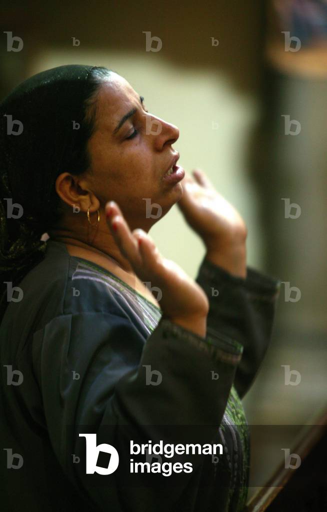 Prayer at El-Moallaqah church Le Caire Egypt