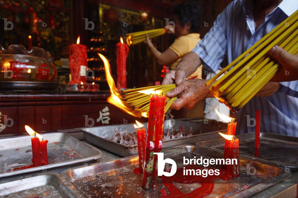 Quan Am Pagoda. Burning Incense during Tet, the Vietnamese lunar New Year celebration, Ho Chi Minh City, Vietnam