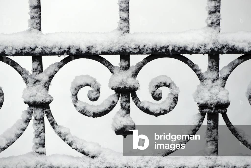Close-up of metal gate with snow, Saint-Gervais, France (photo)