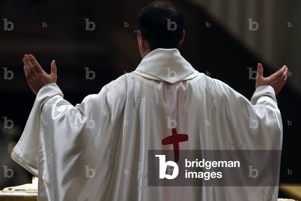 Catholic church during covid-19 epidemic. Sunday mass.  Priest at eucharistic celebration.  Sallanches.  France.