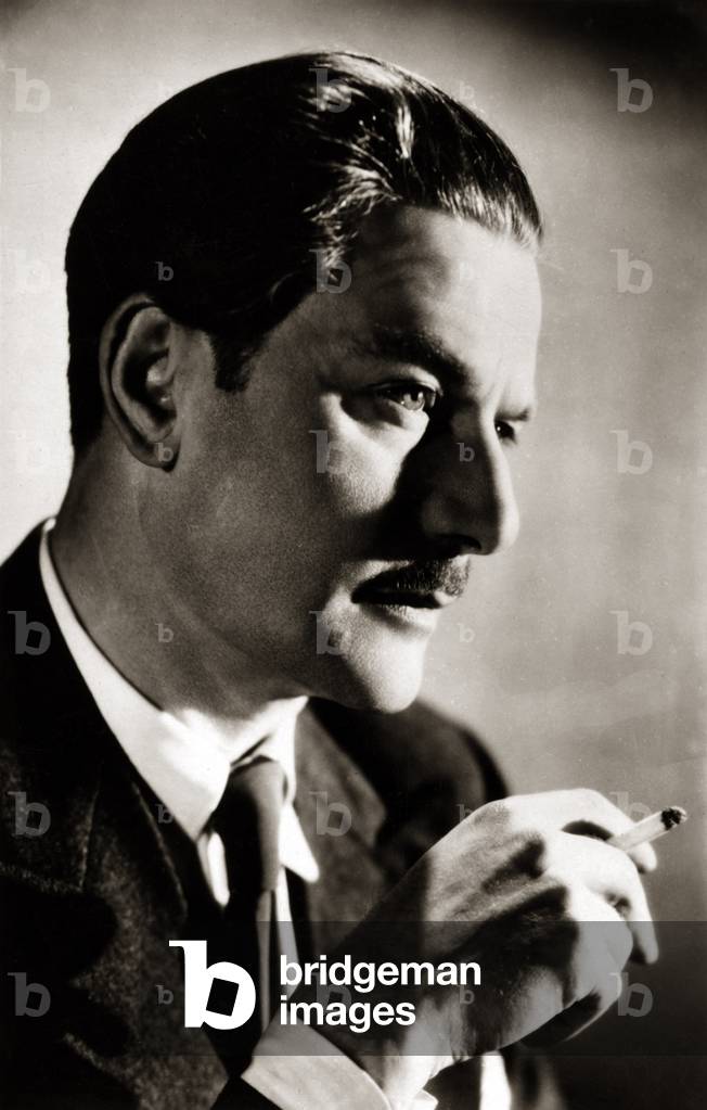 Anton Walbrook, né Adolf Wohlbrück, holding a cigarette