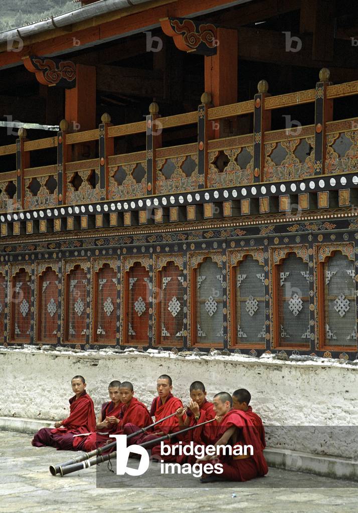Buddhist monks blowing