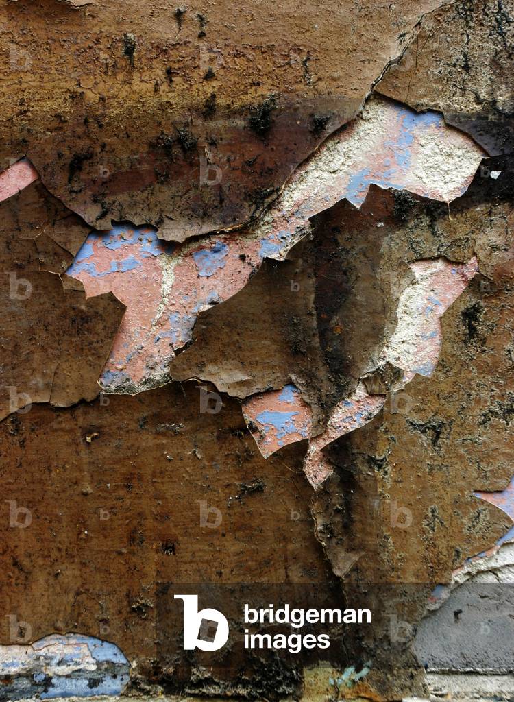 Old wall with torn wall paper, London
