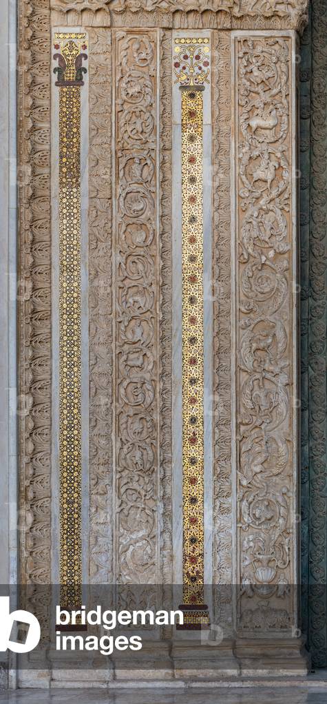 Main portal: detail of the lateral frieze with anthropomorphic figures, animals and geometric mosaic motifs (mosaic)