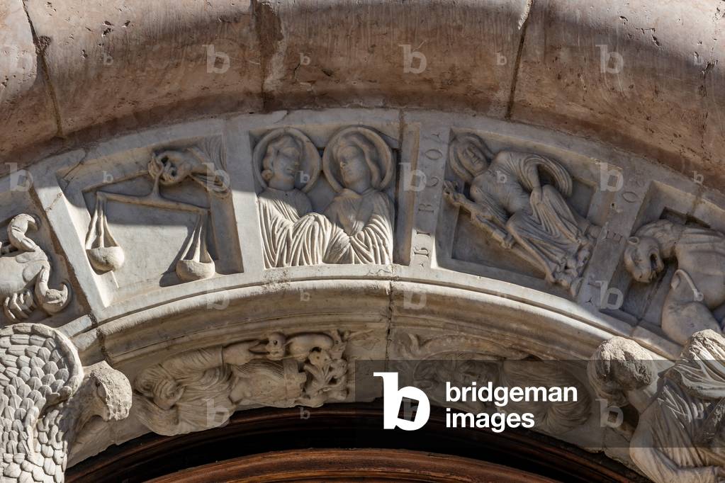 Detail of the frieze of the portal, Entrance door, façade, Cathedral of  St. Feliciano, Foligno, Umbria, Italy (photo)