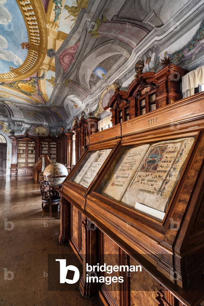 Antoniana Pontifical Library: view of the hall with a globe, bookcases and pieces of furniture showing illuminated choir books, Padua, Veneto, Italia (photo)
