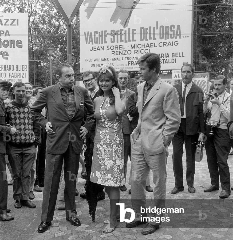 THE ACTRESS CLAUDIA CARDINALE WITH THE DIRECTOR LUCHINO VISCONTI AND THE ACTOR JEAN SOREL AT THE INTERNATIONAL FILM FESTIVAL IN VENICE LIDO - 1965