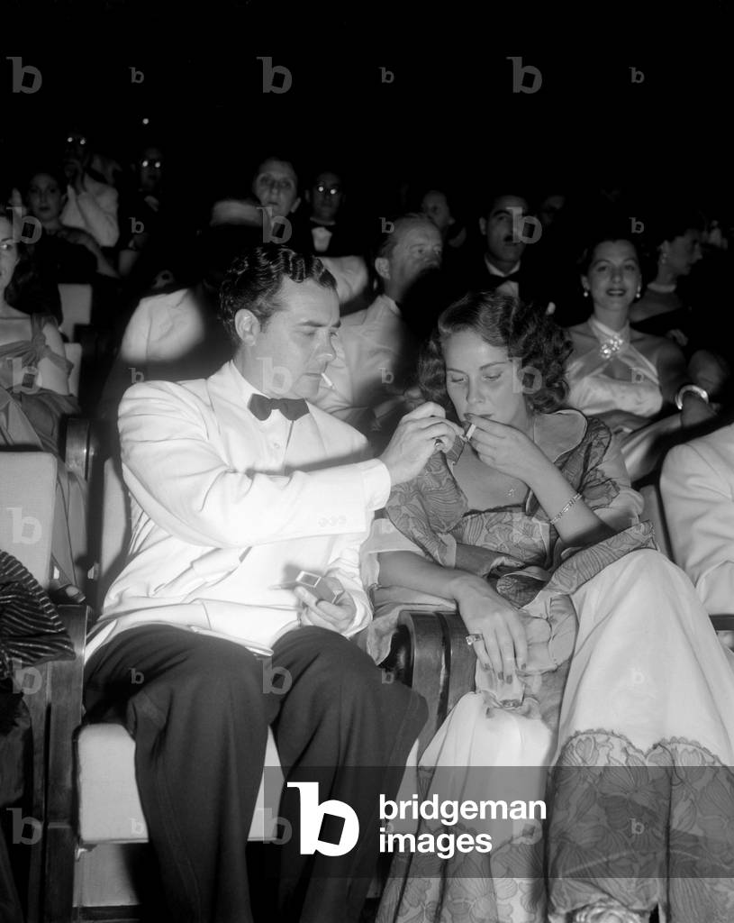 THE ACTRESS ALIDA VALLI WITH HER HUSBAND OSCAR DE MEJO AT THE INTERNATIONAL FILM FESTIVAL IN VENICE - 1950