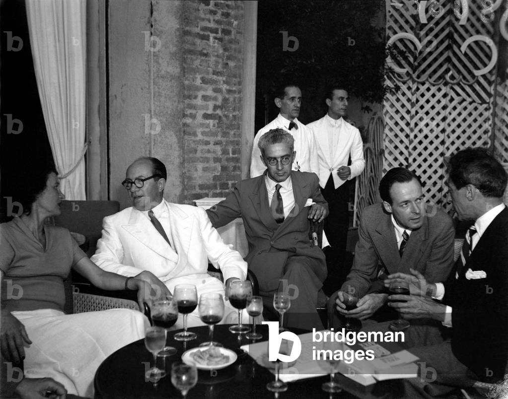 THE POET, WRITER, DIRECTOR AND PAINTER JEAN COCTEAU WITH ART HISTORIAN RODOLFO PALLUCCHINI AND GIOVANNI PONTI AT INTERNATIONAL FILM FESTIVAL IN VENICE - 1948