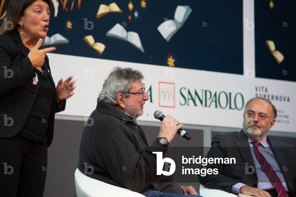Francesco Guccini, Italian singer and writer, with Massimo Bernardini, journalist , and the interpreter for th edeaf