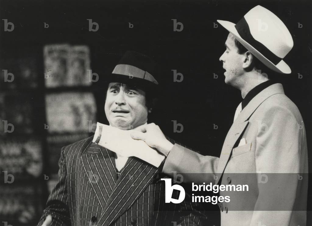 Bob Hoskins as Nathan Detroit and Ian Charleson as Sky Masterson in 'Guys and Dolls' at the National Theatre, 1982 (b/w photo)