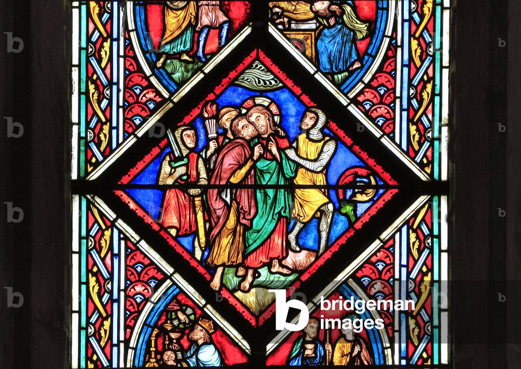 Judas betrays Jesus, with a kiss, in the Garden of Gethsemane, stained glass by Didron of Paris, 1860, detail from The Passion Window, The Easter Story, Kiss of Judas, Feltwell, Norfolk, England (photo) 