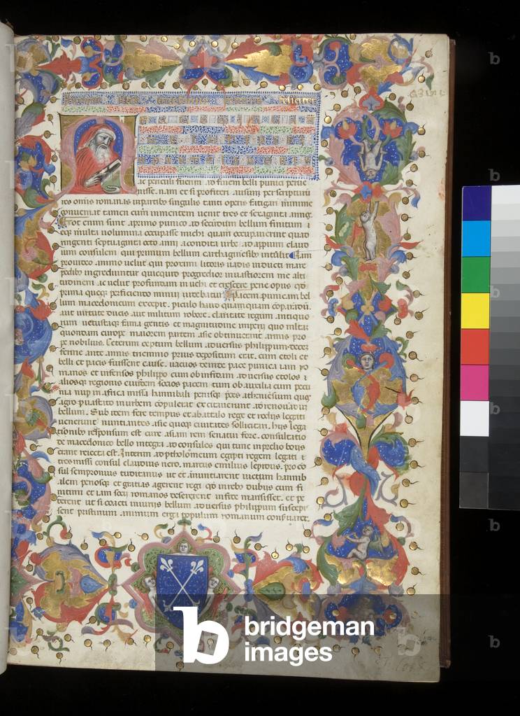Ms 354. Livy, Ab Urbe Condita, 31-40, f.1r. Illuminated incipit page with inhabited initial [M] containing portrait of Livy, full border and arms in the bas-de-page, 1409 (parchment)