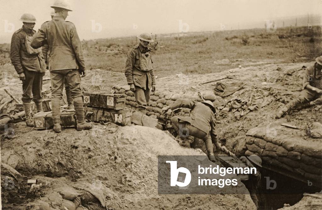 Bombing parties drawing munitions from a bomb store in a support trench, Flanders, 1914-18 (b/w photo)
