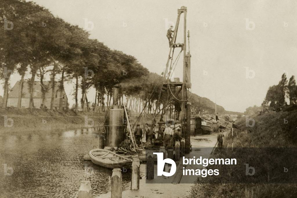Contructing a new wharf on a canal, part of the British effort on the Western Front, 1914-18 (b/w photo)
