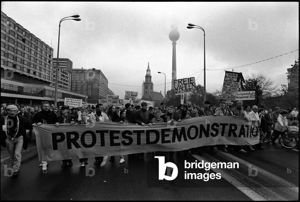 Protesters holding 'Protestdemonstration' banner, in Alexanderplatz, Berlin, East Germany, 4th November 1989 (b/w photo)