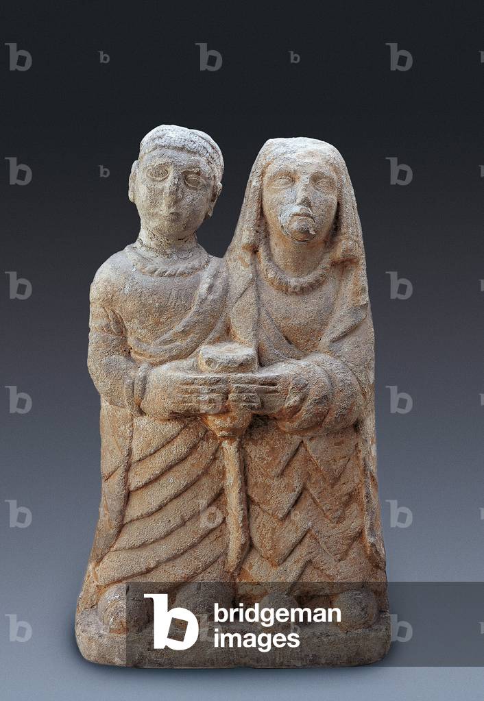Anic art: couple bringing an offering. Stone sculpture, 3rd century BC National Museum of Archaeology of Madrid.