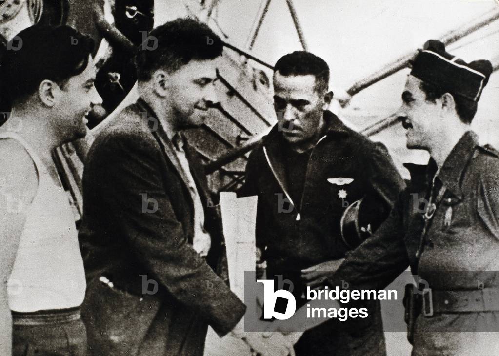 Spanish Civil War (1936-1939): Ilia Grigorievich Ehrenburg (1891-1967), Russian writer, on his arrival at Barcelona airport (Spain) (second from left), as a Soviet correspondent of the Civil War, 1936 (b/w photo)