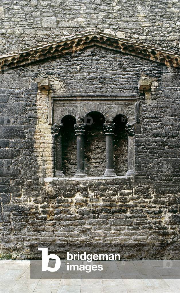 Window of the original church founded in the 9th century (stone)