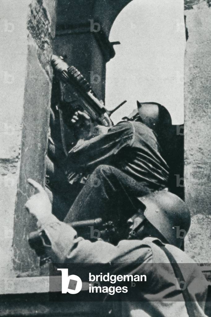 Spanish Civil War (1936-1939): Soldiers shooting on the air force in the Basque Country, April 1937 (b/w photo)