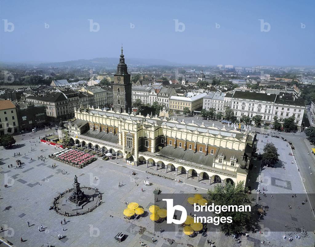 Place du Marche in Krakow (Poland), with the side arches of the Sukiennice (edited in the 14th, modified in 1555). Photograph.