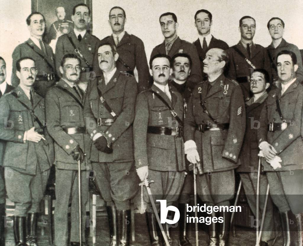 Portrait of General Francisco Franco y Bahamonde (1892-1975) (first row, center) and Jose Millan-Astray (on his right) during the ceremony of giving the Honorary Sabre of the Legion to Franco. Ministry of War of Madrid, 1927 (b/w photo)
