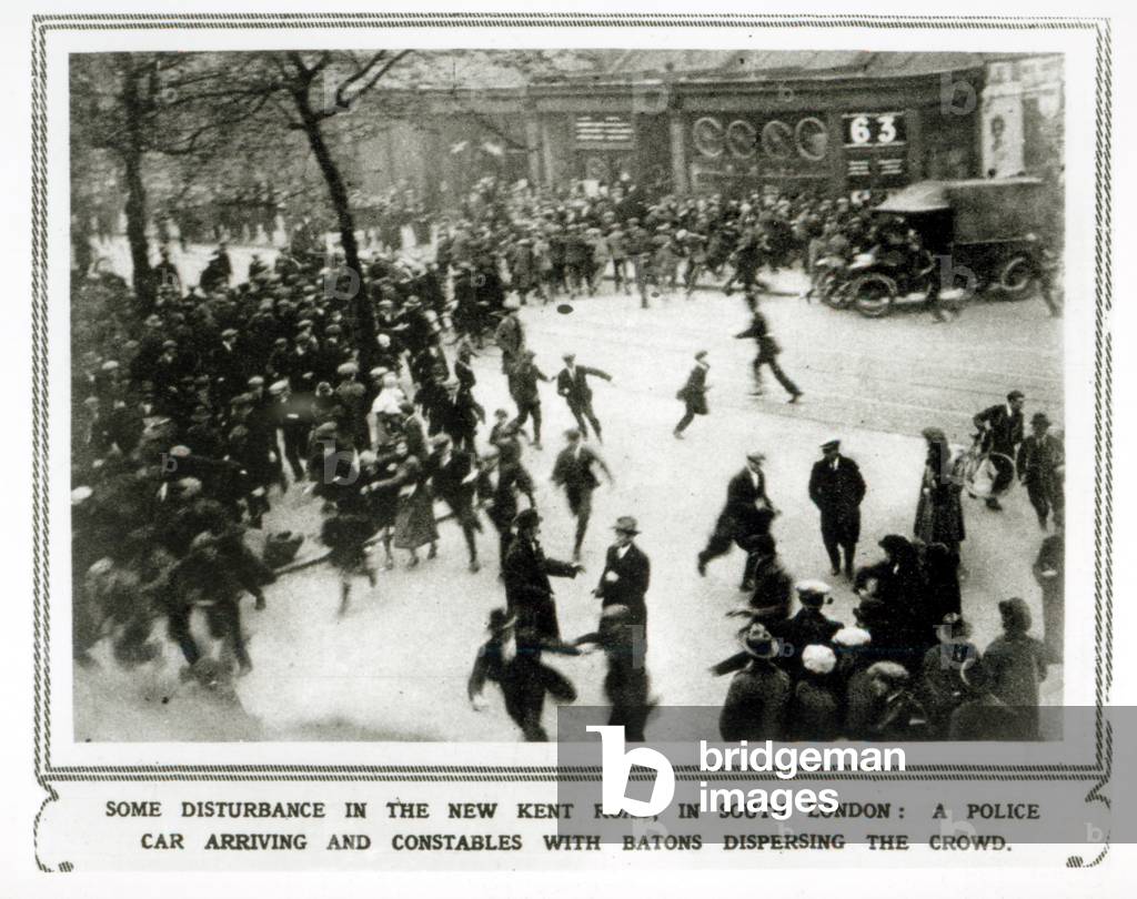 Some Disturbance in the New Kent Road, in South London: A Police Car Arriving and Constables with Batons Dispersing a Crowd, from 'The Illustrated London News', 15th May 1926 (b&w photo)