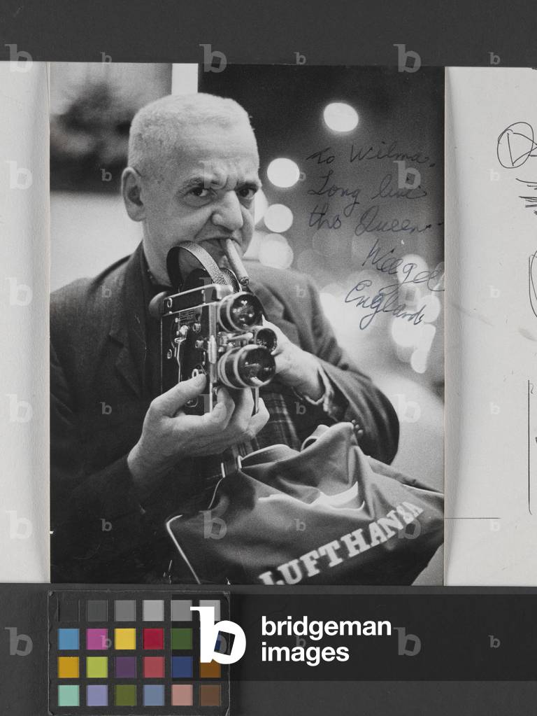 Weegee With Movie Camera And Lufthausa Bag (gelatin silver print)