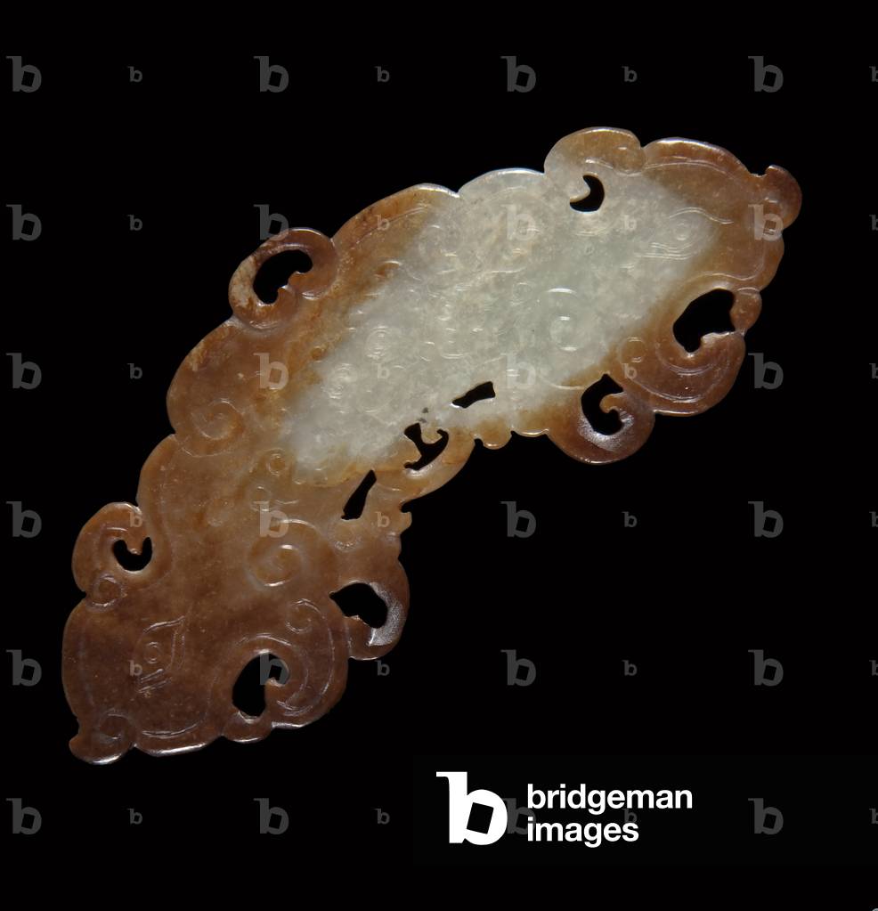 Huang, arc-shaped pendant (white nephrite, rust to dark brown areas)