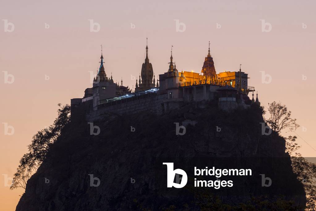 Buddhist nonastery, Tuyin Taung Pagoda on the volcanic cone of Taung Kalat, at sunset, Mount Popa, Mandalay Region, Myanmar