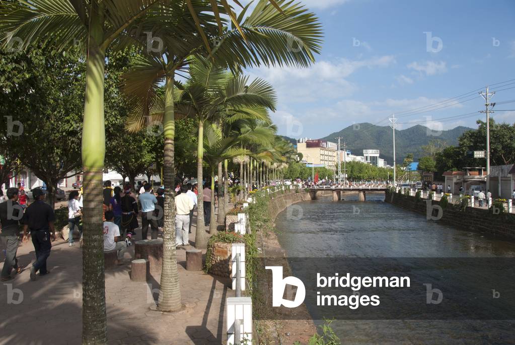 Promenade alongside the river with palm trees; Jiangcheng; Pu'er City; Yunnan Province; People's Republic of China; Southeast Asia; Asia