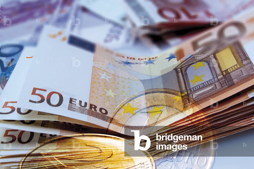European currency. Composition of 50 euro banknotes and 1 and 2 euro coins. Photography