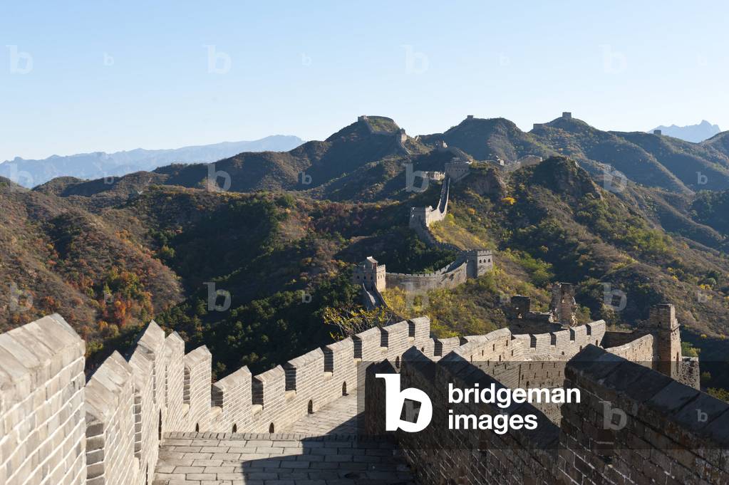 Great Wall of China; historical border fortress with battlements; restored section with watchtowers; winding its way over mountain ridge; Jinshanling; China; Asia