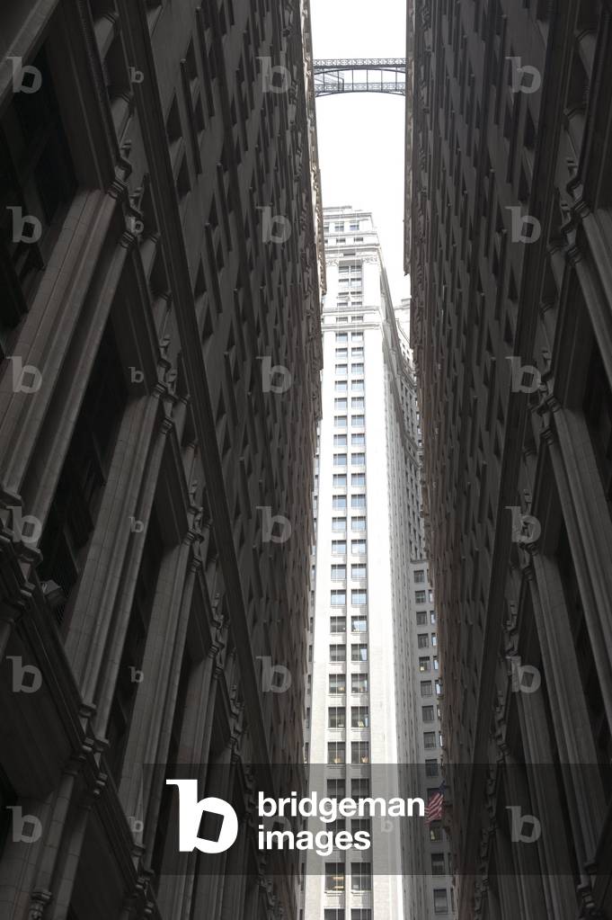 Narrow passage between high-rise buildings close to each other from a worms-eye view; Financial District; Manhattan; New York City; USA; North America
