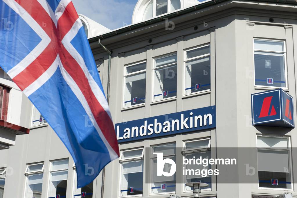 House facade; logo; lettering; Landsbankinn national bank; Iceland's national flag; Reykjavik; Island; Iceland; Scandinavia; Northern Europe; Europe