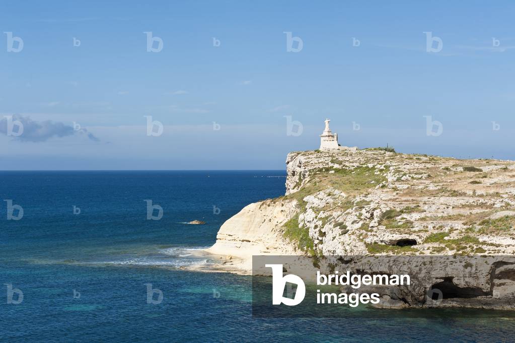Rocky small island with monument; St. Paul's Islands; Il-Gzejer ta 'San Pawl; Malta; Europe