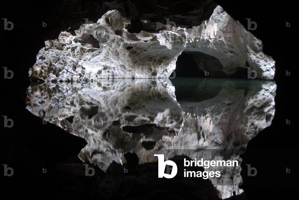 Potholing; speleology; quiet lake; reflection; water in the Tham Pha Incave in Thakek; Khammuan province; Khammouane; Laos; Southeast Asia; Asia