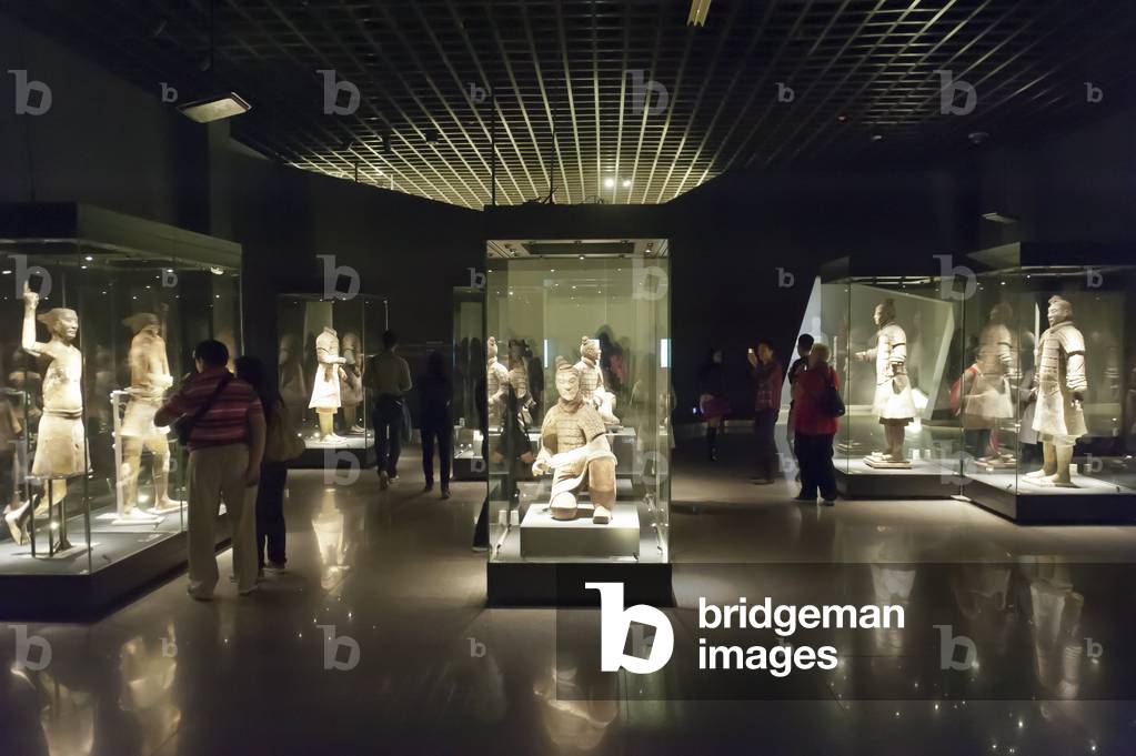 Museum; standing warriors painted with original colour in glass display cases; Emperor Qin Shi Huang Mausoleum; Terracotta Army; Xi'an; People's Republic of China