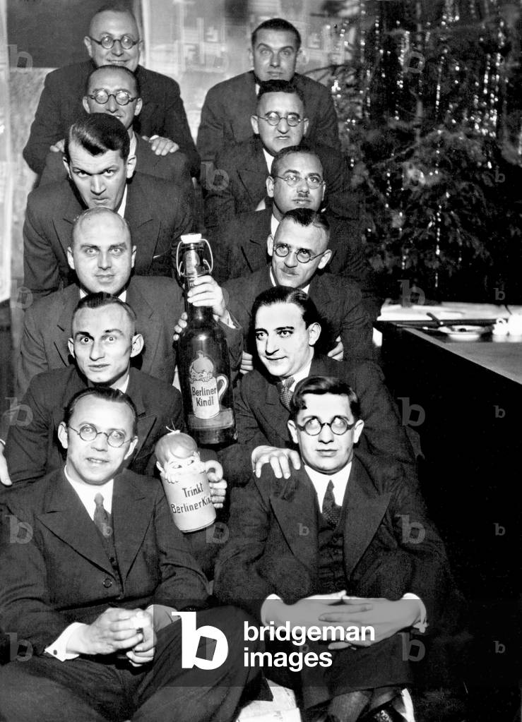 Ten men celebrating Christmas. Photography 1932