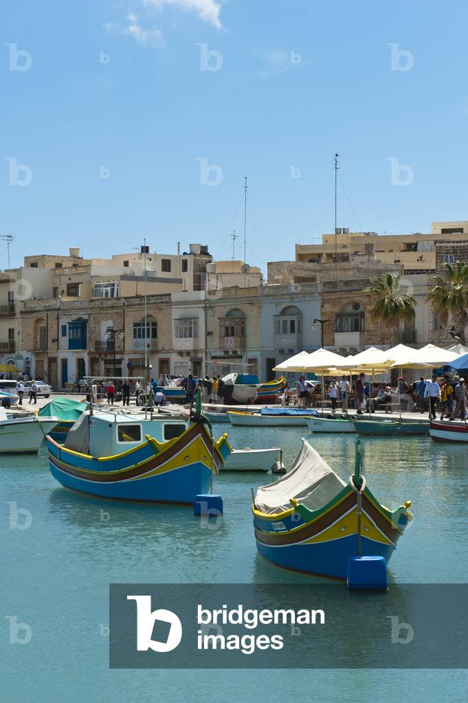 Colorfully painted traditional fishing boats; Luzzu; harbour of Marsaxlokk; Malta; Europe