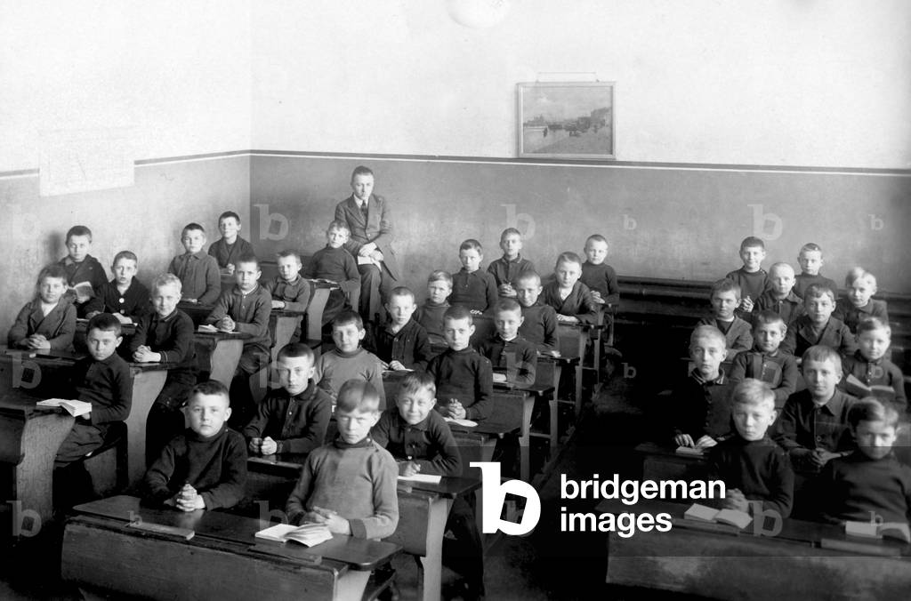 A boy class, the schoolboys are in uniform.