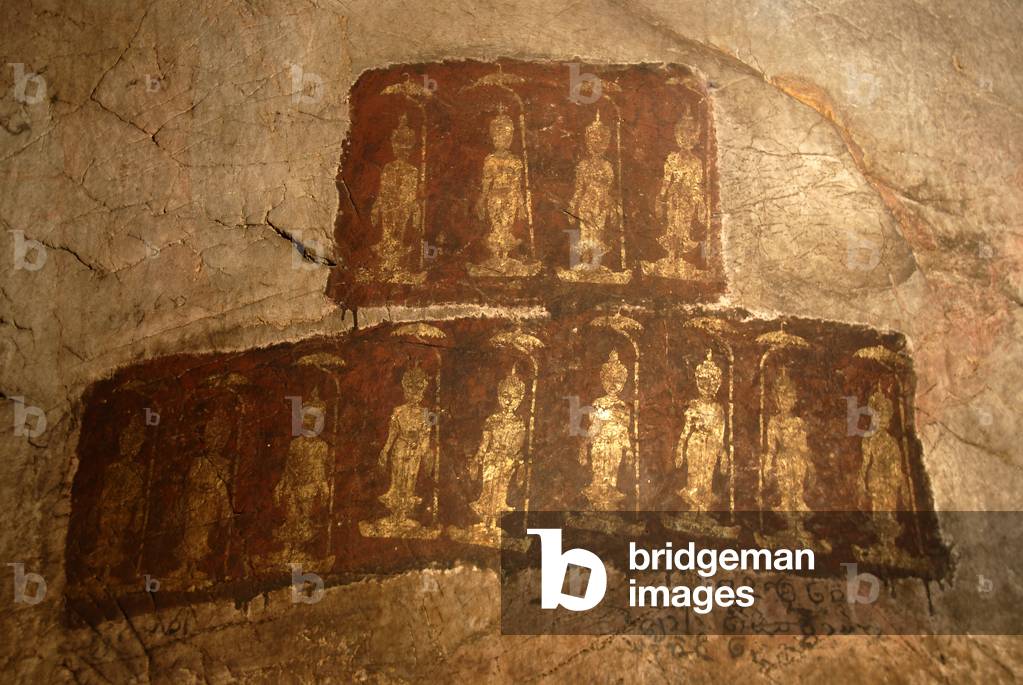 Theravada Buddhism; ancient wall painting; standing Buddha Shakyamuni; Mudra; Varada; gesture of wish-granting; Tham Pa cave; at Nong Thang; Xieng Khouang province; Laos; Southeast Asia; Asia