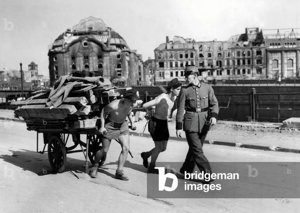 Reconstruction of Germany after World War I 1914-1918: two boys pulling a cart. Photography around 1945