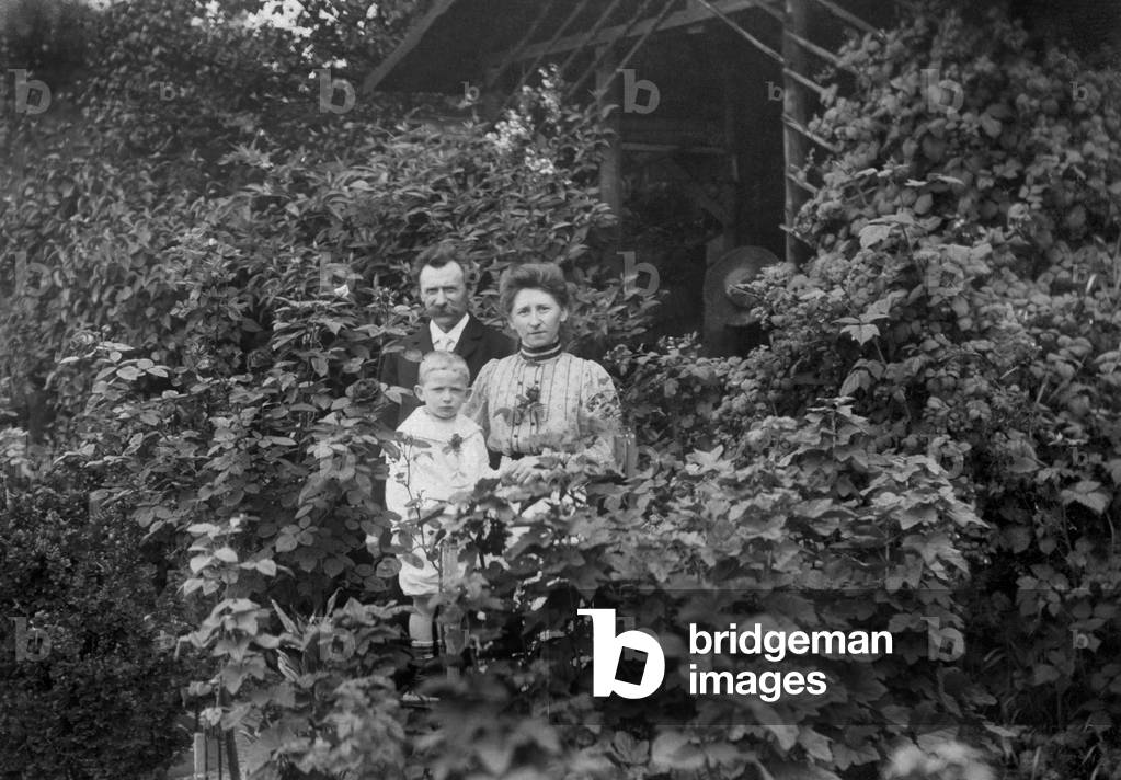 Family portrait in a garden. Photography around 1930