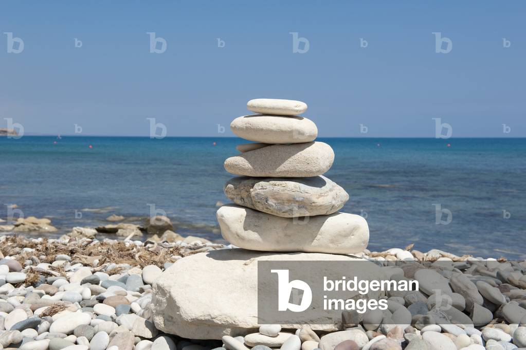 Stacked stones; cairn on the beach; gravel beach; Pissouri Beach; Cape Aspro; eastern Mediterranean sea; Cyprus; Europe