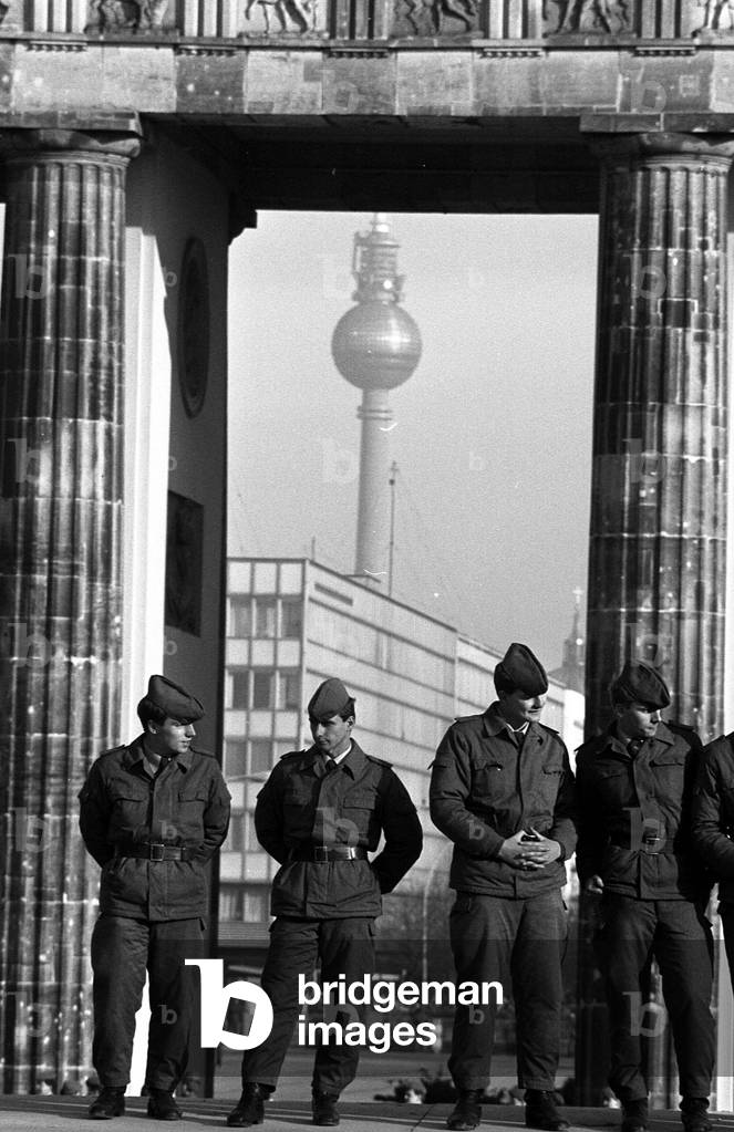 East German soldiers positioned on the wall in the Reichstag sector, 11 November, 1989 (b/w photo)