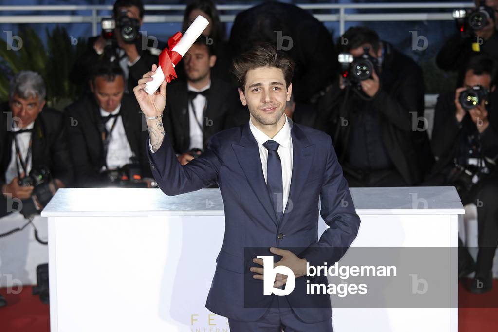 Xavier Dolan with the Grand Prix for Juste la fin du monde at the award winners photocall during the