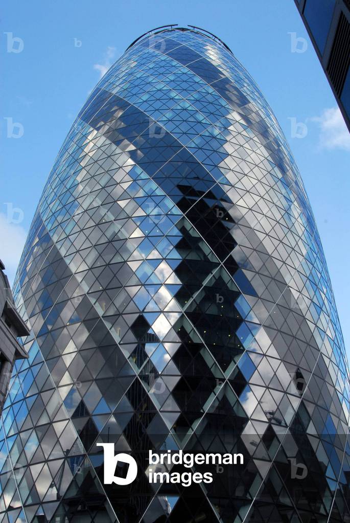 Swiss Re Building, London - known as 'The Gherkin' - on city skyline, from across the Thames